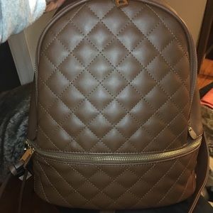 Brown small backpack with wallet included